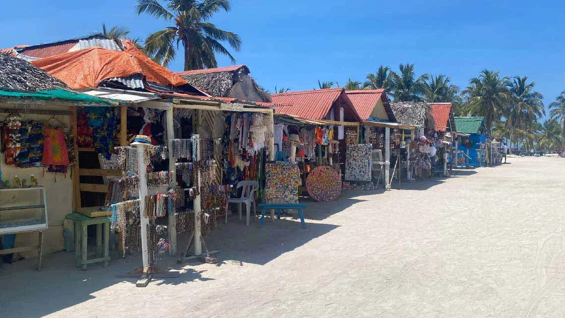 Stalls and beach in the fishing village of Bayahíbe