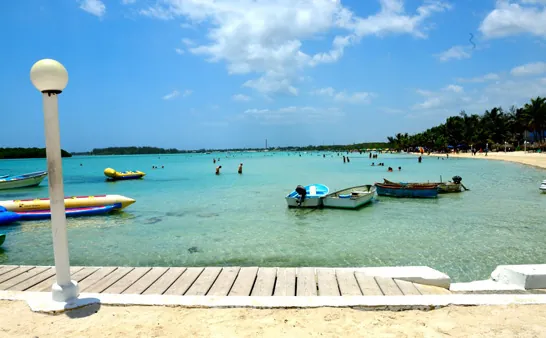 Calm waters of Boca Chica beach with boats